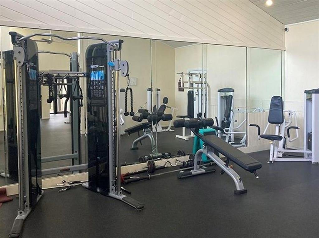 2216 North Cypress Bend Drive, Unit 504 Pompano Beach, FL 33069 - Photo 29 of 33 a room with gym equipment