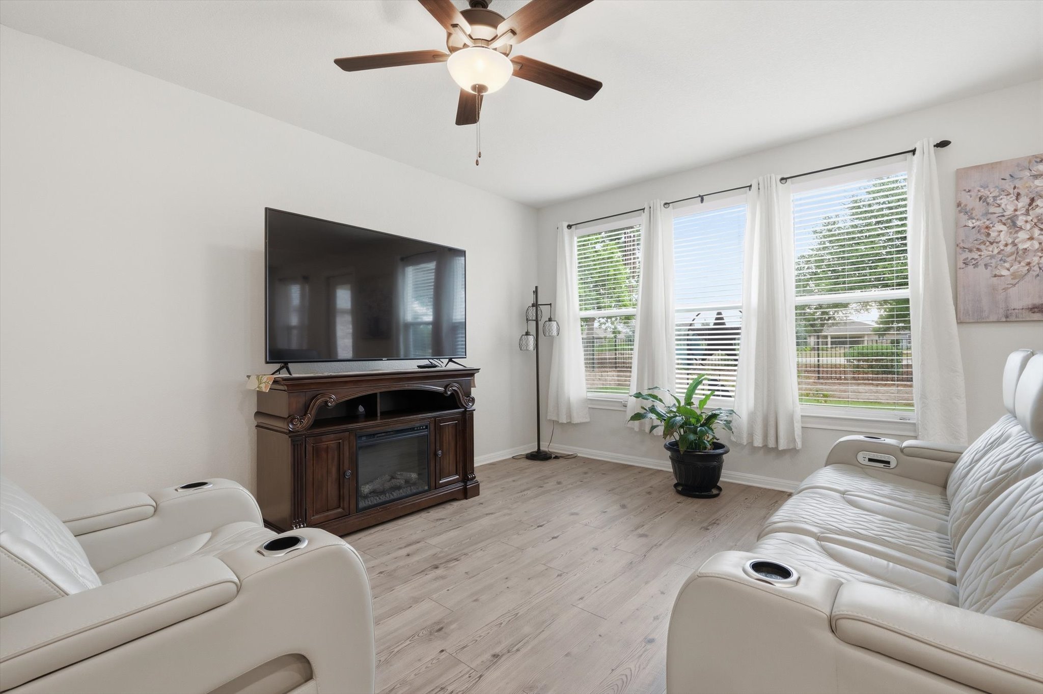 113 Lafayette Street Georgetown, TX 78633 - Photo 19 of 39 Living area featuring light wood-finish flooring and a ceiling fan