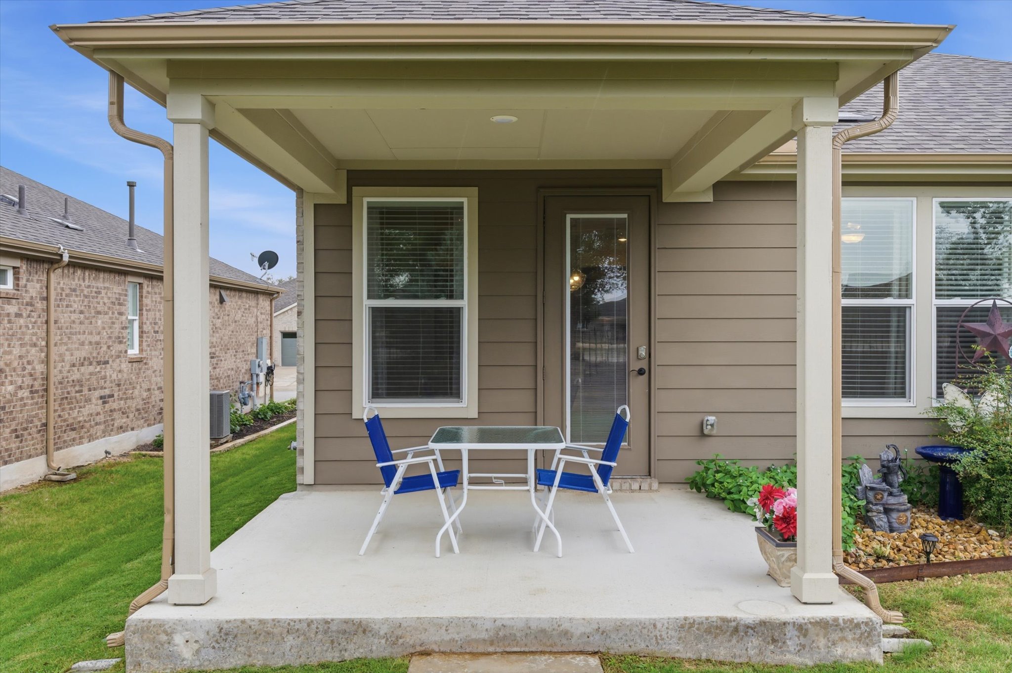113 Lafayette Street Georgetown, TX 78633 - Photo 34 of 39 Covered concrete patio featuring a single light fixture, a full-lite exterior door, and horizontal siding