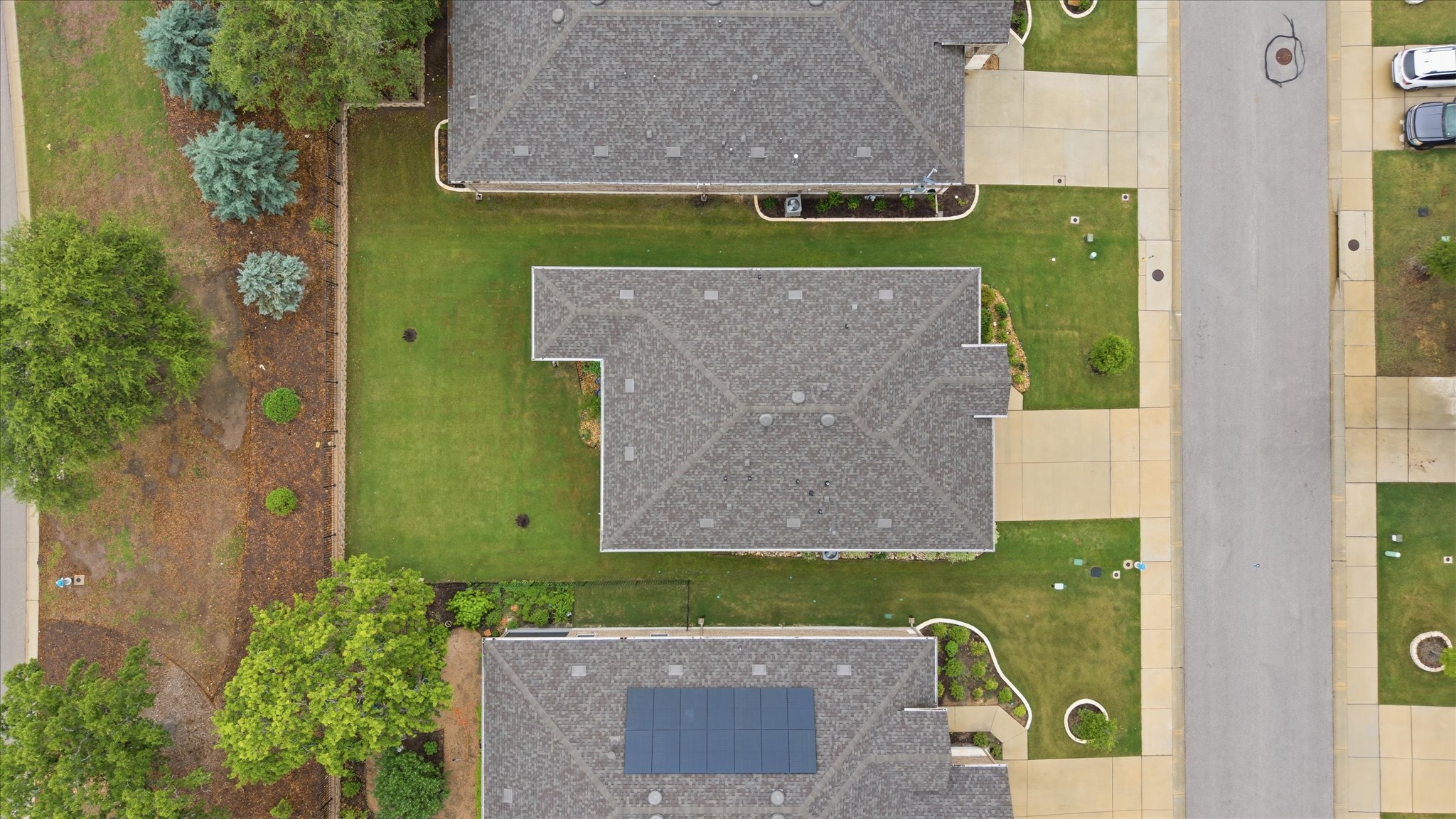 113 Lafayette Street Georgetown, TX 78633 - Photo 39 of 39 Aerial view showcasing a residential property with a shingled roof and a manicured lawn