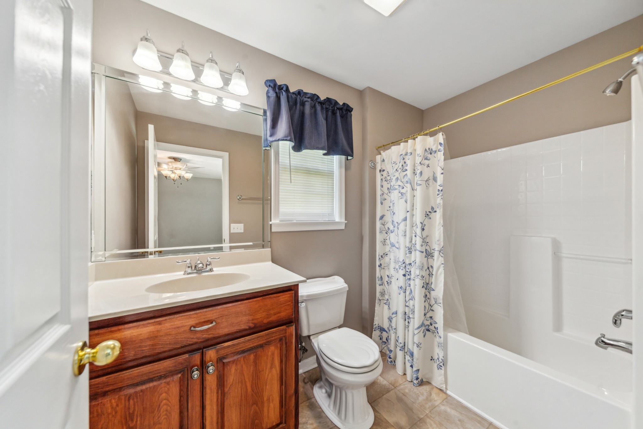447 Canaan Road Columbia, TN 38401 - Photo 31 of 39 a bathroom with a sink a toilet a mirror a vanity and shower
