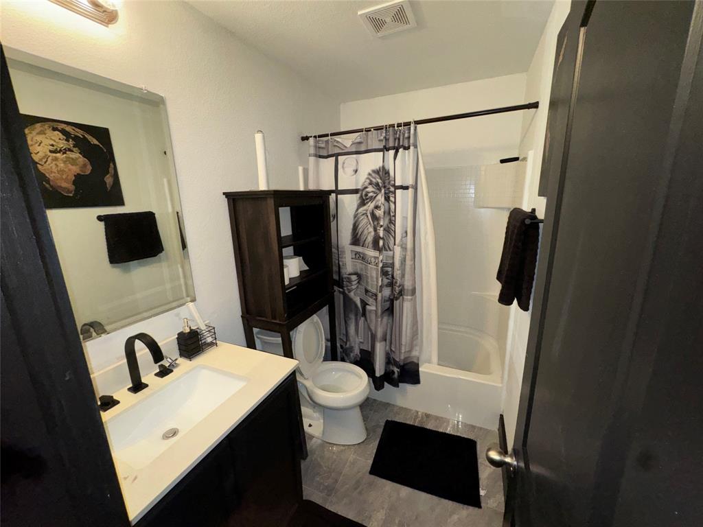 104 Anthony Lane Red Oak, TX 75154 - Photo 12 of 16 Bathroom featuring shower / tub combo and vanity