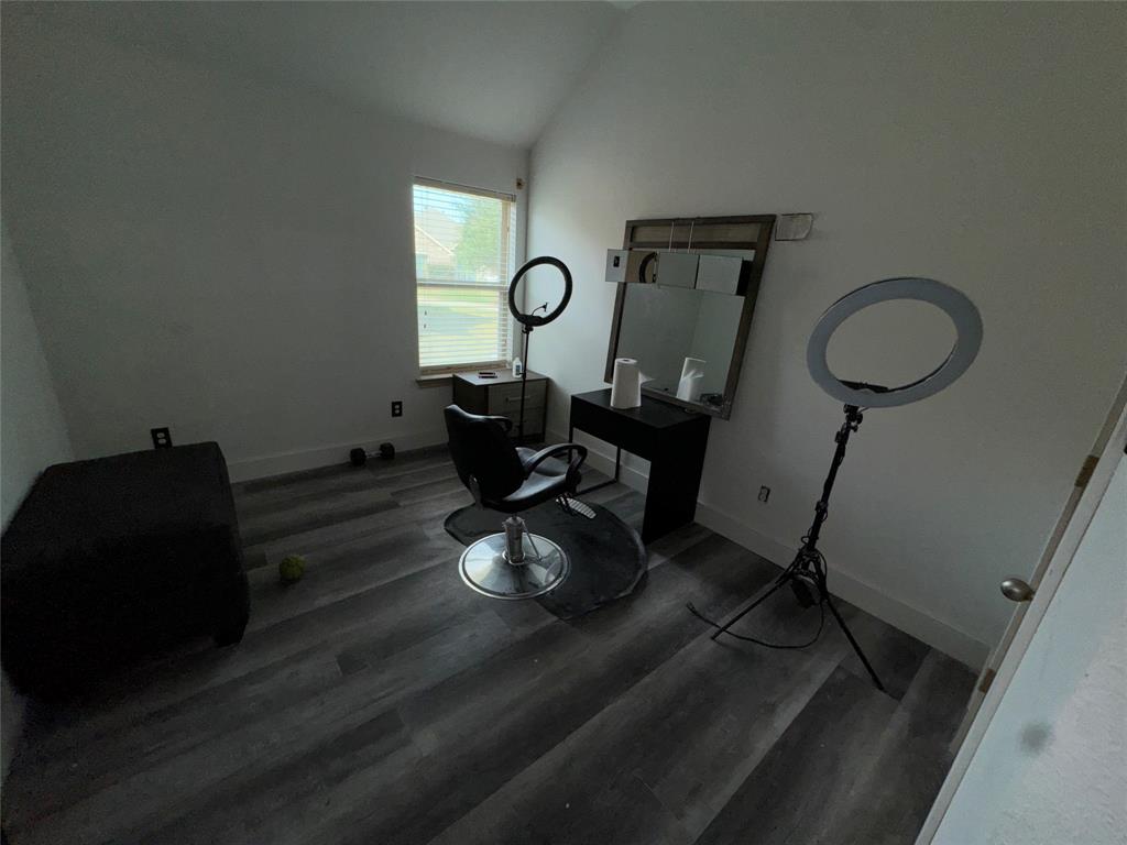 104 Anthony Lane Red Oak, TX 75154 - Photo 13 of 16 Bedroom with vaulted ceiling and dark wood-style flooring