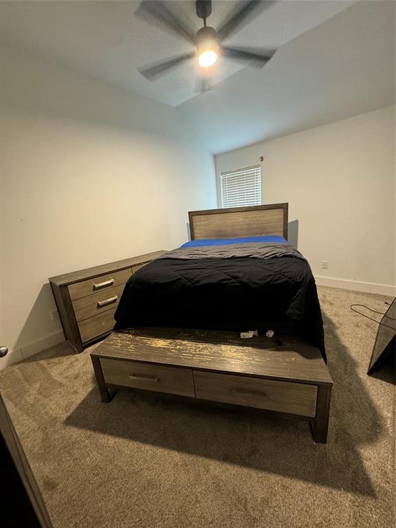 104 Anthony Lane Red Oak, TX 75154 - Photo 14 of 16 Bedroom featuring light carpet, lofted ceiling, and a ceiling fan