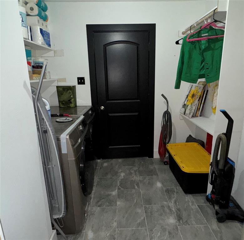 104 Anthony Lane Red Oak, TX 75154 - Photo 15 of 16 Laundry room with washer and clothes dryer