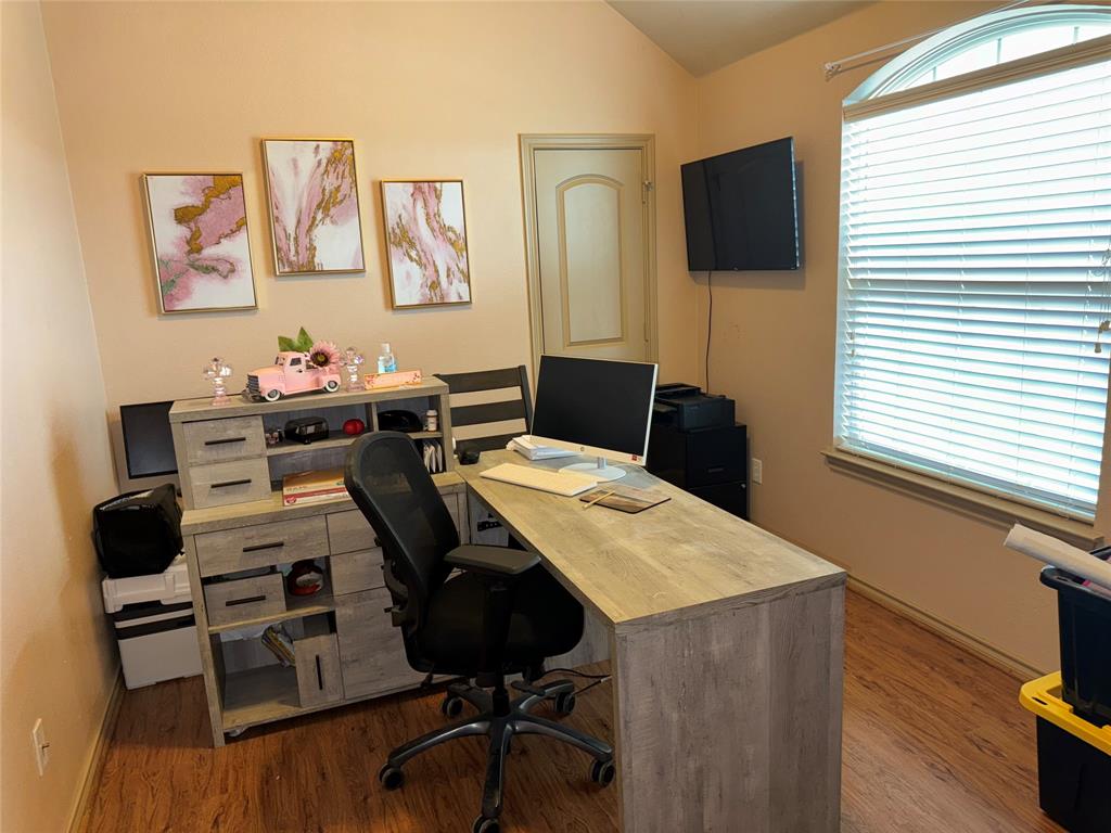 104 Anthony Lane Red Oak, TX 75154 - Photo 16 of 16 Home office with dark wood-type flooring and vaulted ceiling