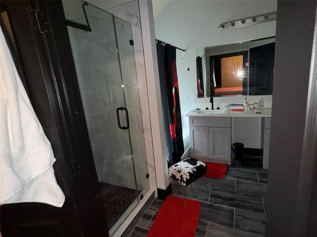 104 Anthony Lane Red Oak, TX 75154 - Photo 8 of 16 Bathroom featuring a marble finish shower, vanity, and ensuite bathroom