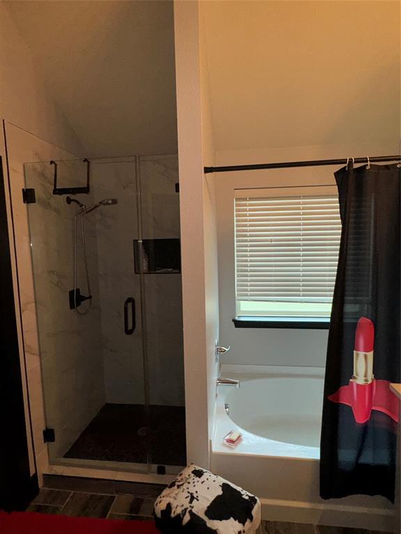 104 Anthony Lane Red Oak, TX 75154 - Photo 9 of 16 Bathroom featuring a bath, a stall shower, and lofted ceiling