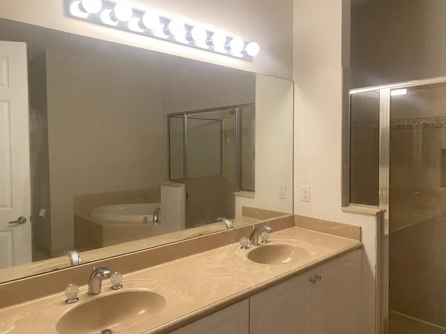 a bathroom with a toilet a sink and bathtub