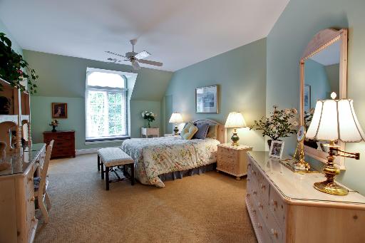 804 Cleveland Road Hinsdale, IL 60521 - Photo 11 of 16 a bedroom with bed and a chandelier