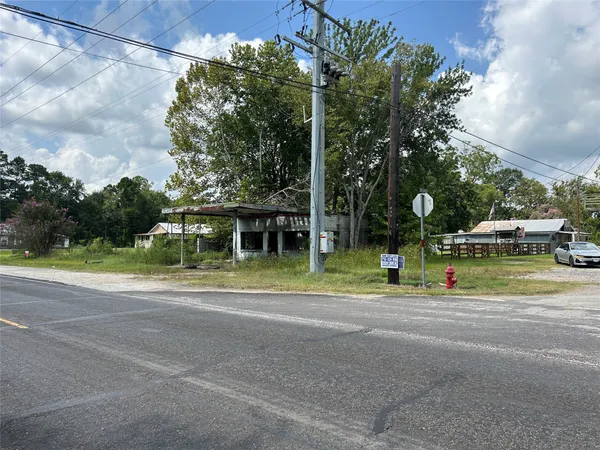 a view of street with houses and trees