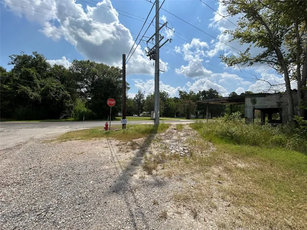 a view of a backyard with swimming pool