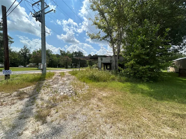 a view of street with houses and trees