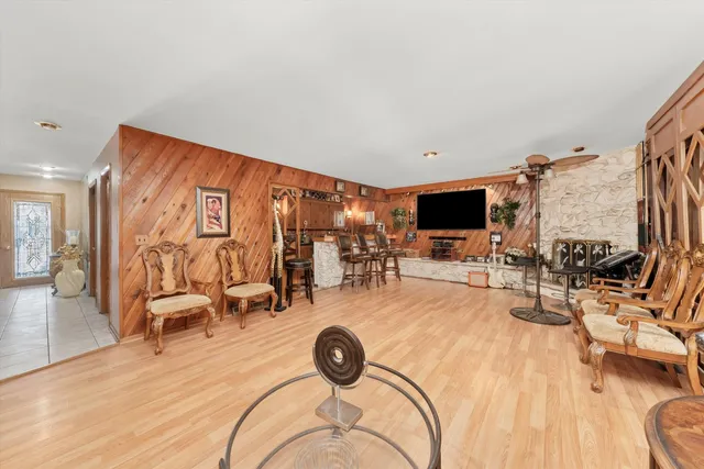 a view of a livingroom with furniture and a flat screen tv