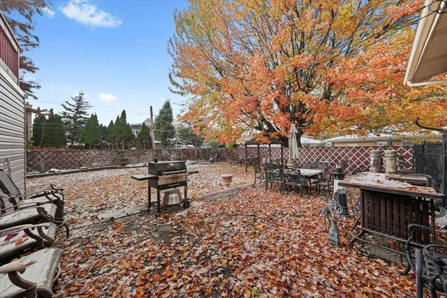 a view of a bench in a backyard