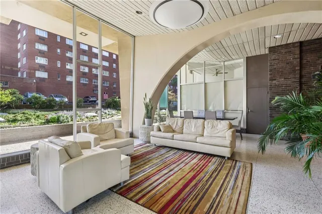 a balcony with furniture and a potted plant