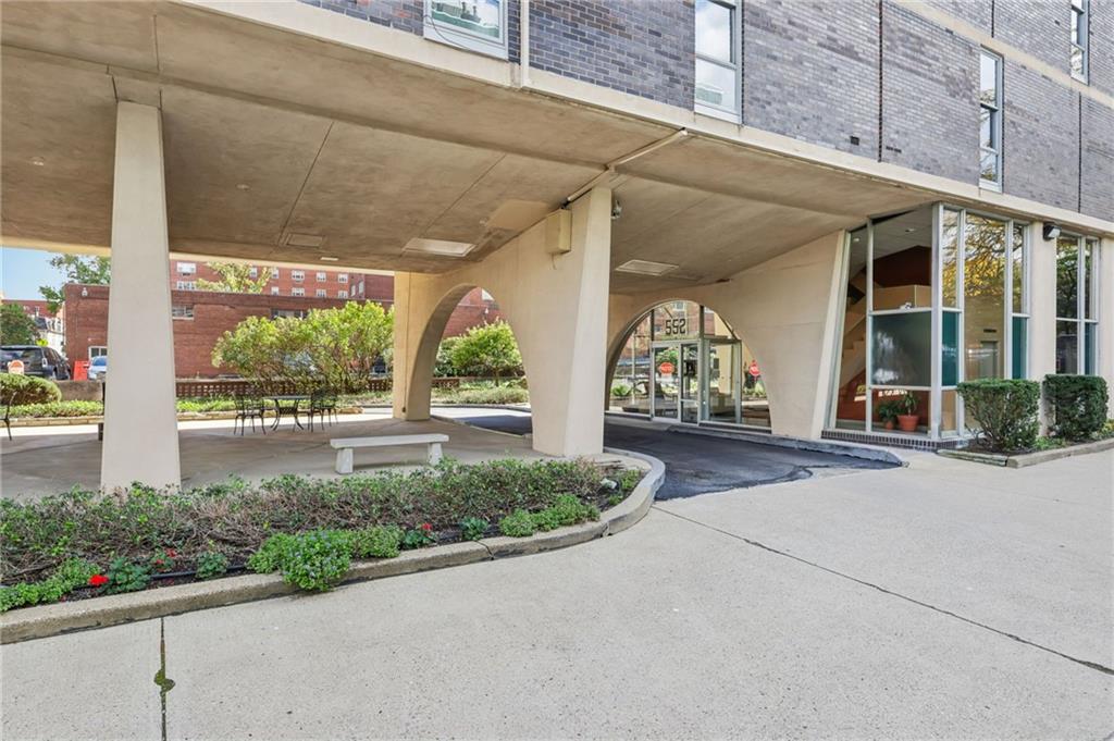552 North Neville Street, Unit 21 Pittsburgh, PA 15213 - Photo 15 of 35 a view of a brick house with potted plants