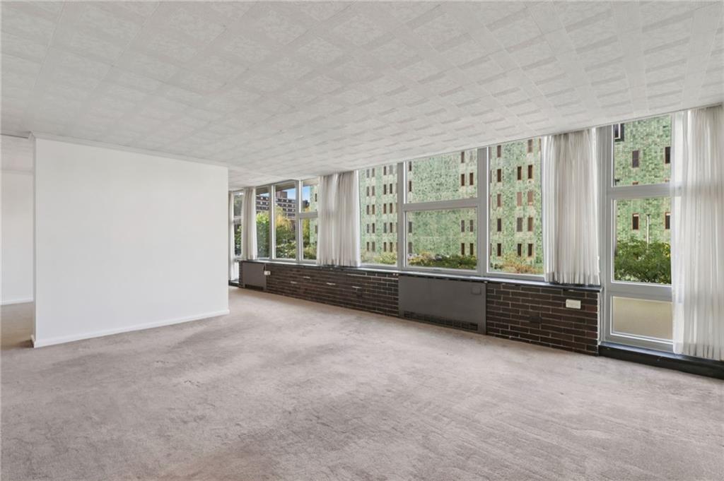 552 North Neville Street, Unit 21 Pittsburgh, PA 15213 - Photo 18 of 35 an empty room with windows and view of balcony