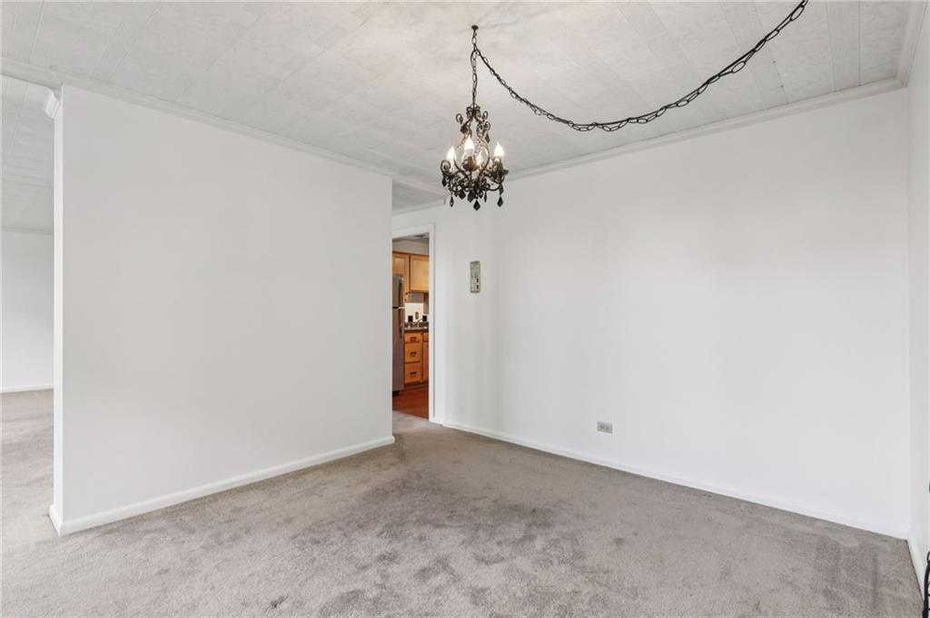 552 North Neville Street, Unit 21 Pittsburgh, PA 15213 - Photo 25 of 35 a view of a chandelier in a room