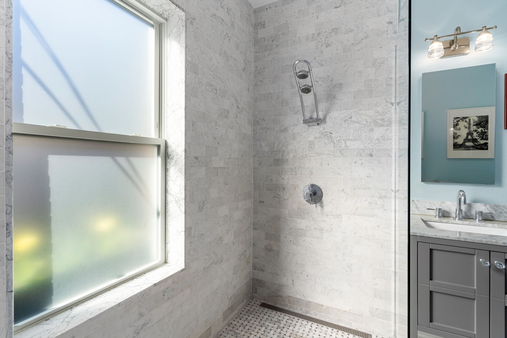 17 Walker Street Boston, MA 02129 - Photo 12 of 24 a bathroom with a shower and a sink