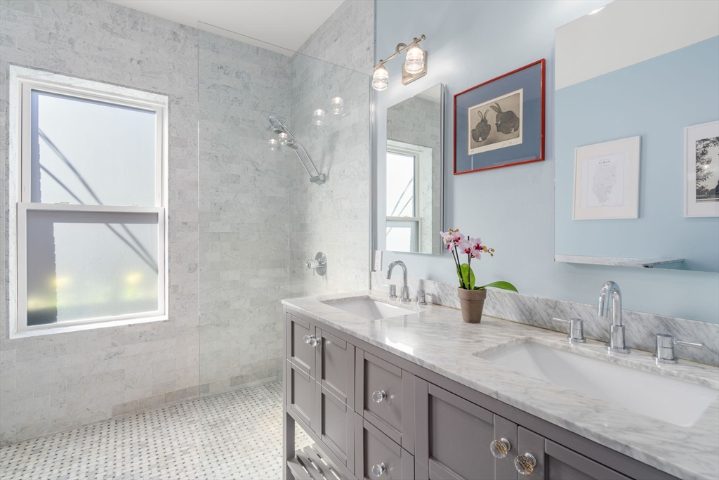 17 Walker Street Boston, MA 02129 - Photo 13 of 24 a bathroom with a granite countertop sink mirror and window