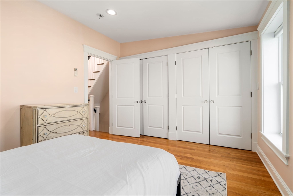 17 Walker Street Boston, MA 02129 - Photo 17 of 24 a bedroom with a bed and a window