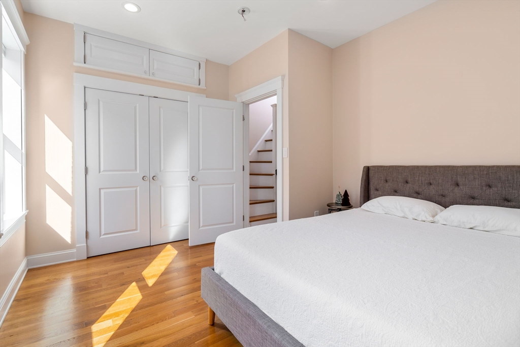 17 Walker Street Boston, MA 02129 - Photo 18 of 24 a spacious bedroom with a bed and a window