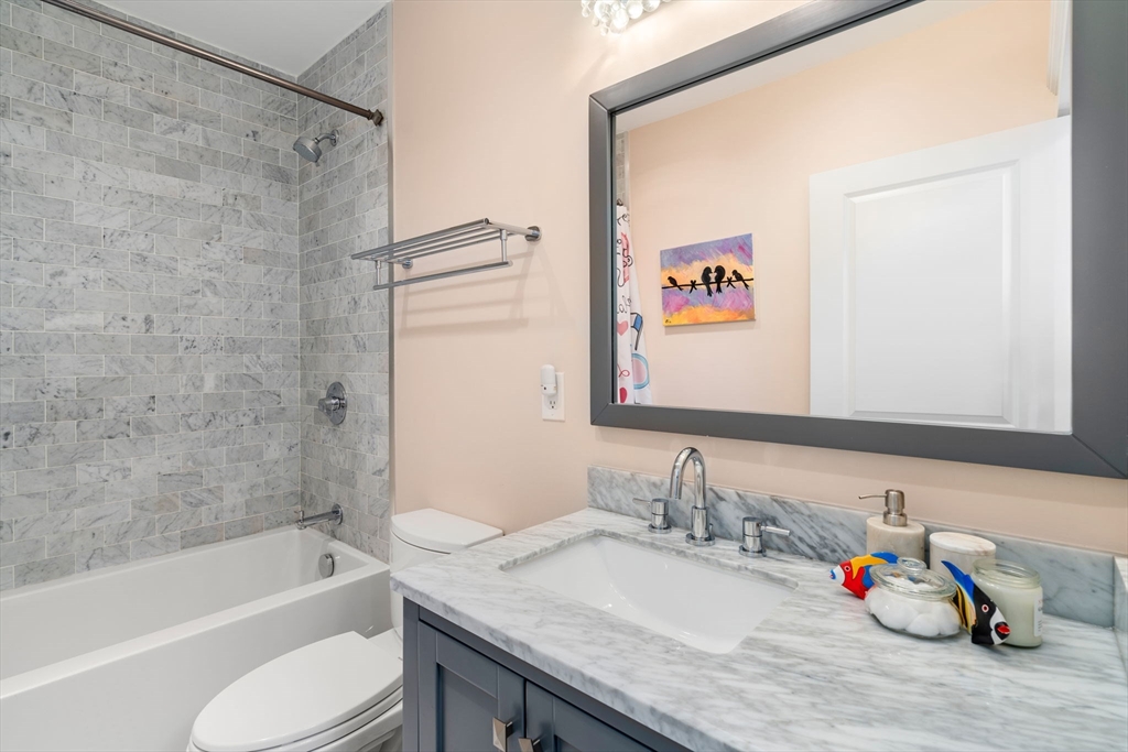 17 Walker Street Boston, MA 02129 - Photo 19 of 24 a bathroom with a sink and a mirror