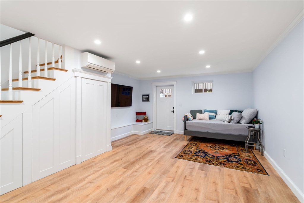 17 Walker Street Boston, MA 02129 - Photo 20 of 24 a living room with furniture and a flat screen tv