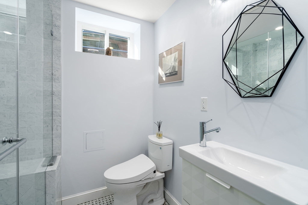 17 Walker Street Boston, MA 02129 - Photo 22 of 24 a bathroom with a sink and a mirror