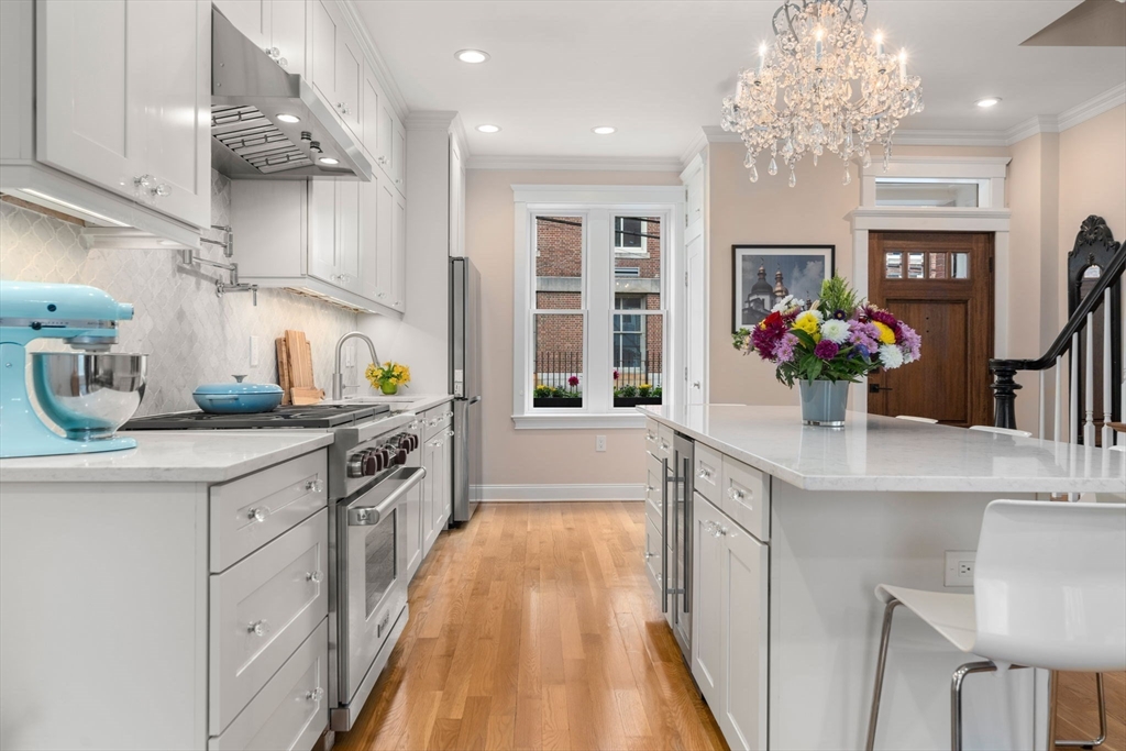 17 Walker Street Boston, MA 02129 - Photo 5 of 24 a kitchen with stainless steel appliances granite countertop a sink and a white cabinets