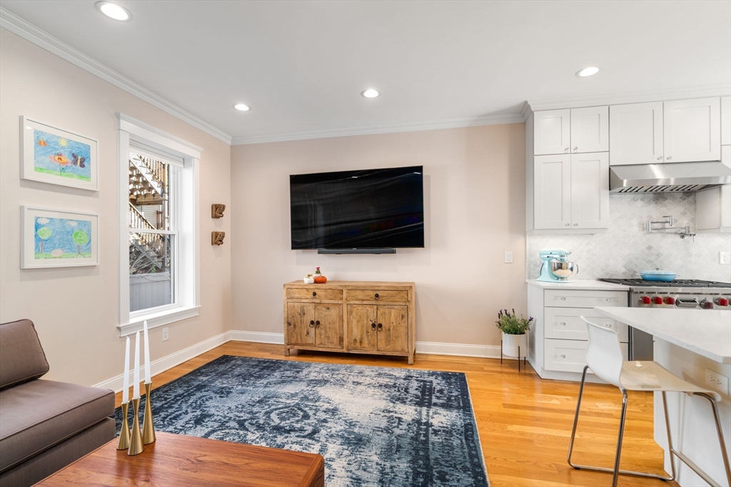 17 Walker Street Boston, MA 02129 - Photo 8 of 24 a living room with furniture and a flat screen tv