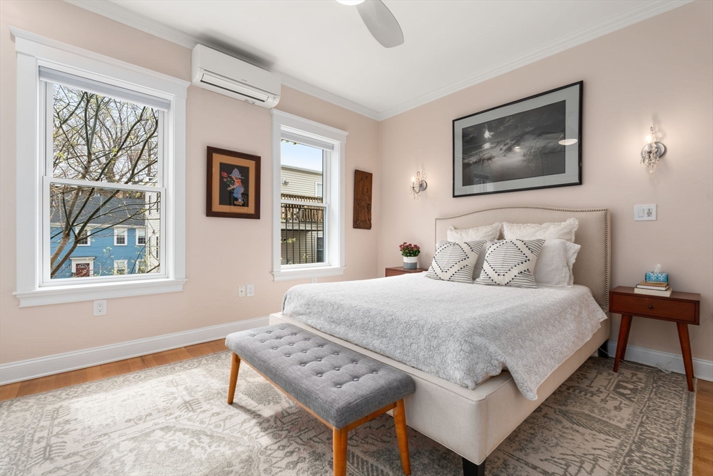 17 Walker Street Boston, MA 02129 - Photo 9 of 24 a bedroom with a bed a painting and a window