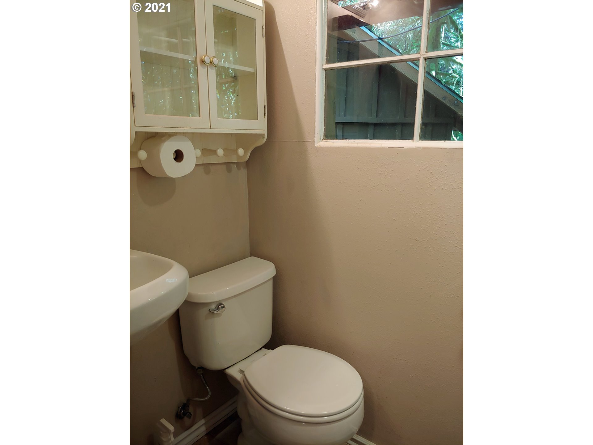27525 Road 20 Rhododendron, OR 97049 - Photo 16 of 22 a white toilet sitting next to a bathroom sink