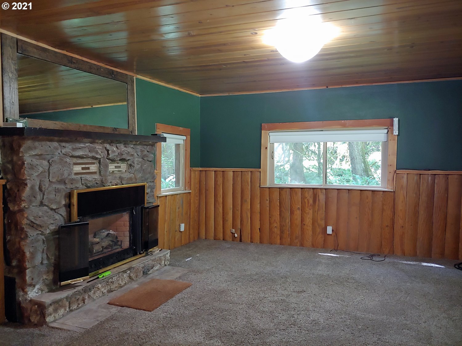 27525 Road 20 Rhododendron, OR 97049 - Photo 7 of 22 a living room with a fireplace