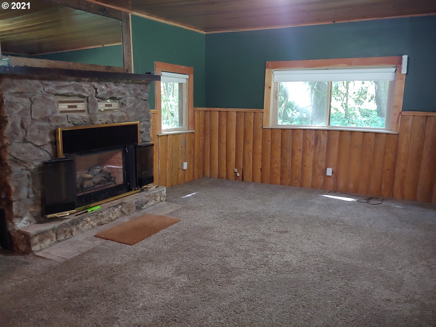 27525 Road 20 Rhododendron, OR 97049 - Photo 8 of 22 a living room with furniture and a fireplace