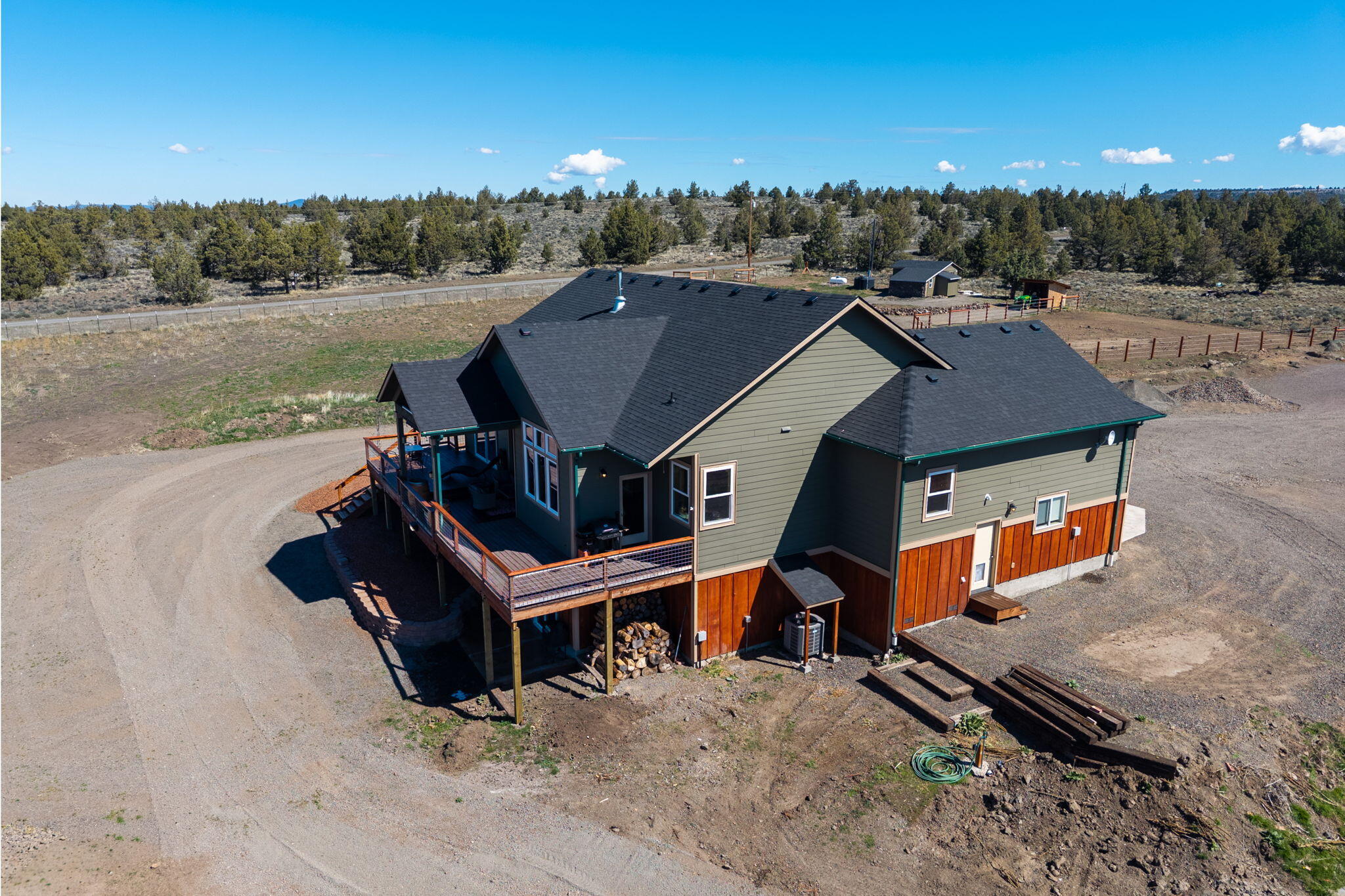6040 Gravett Road Prineville, OR 97754 - Photo 52 of 77 an aerial view of a house with a yard swimming pool and mountain view