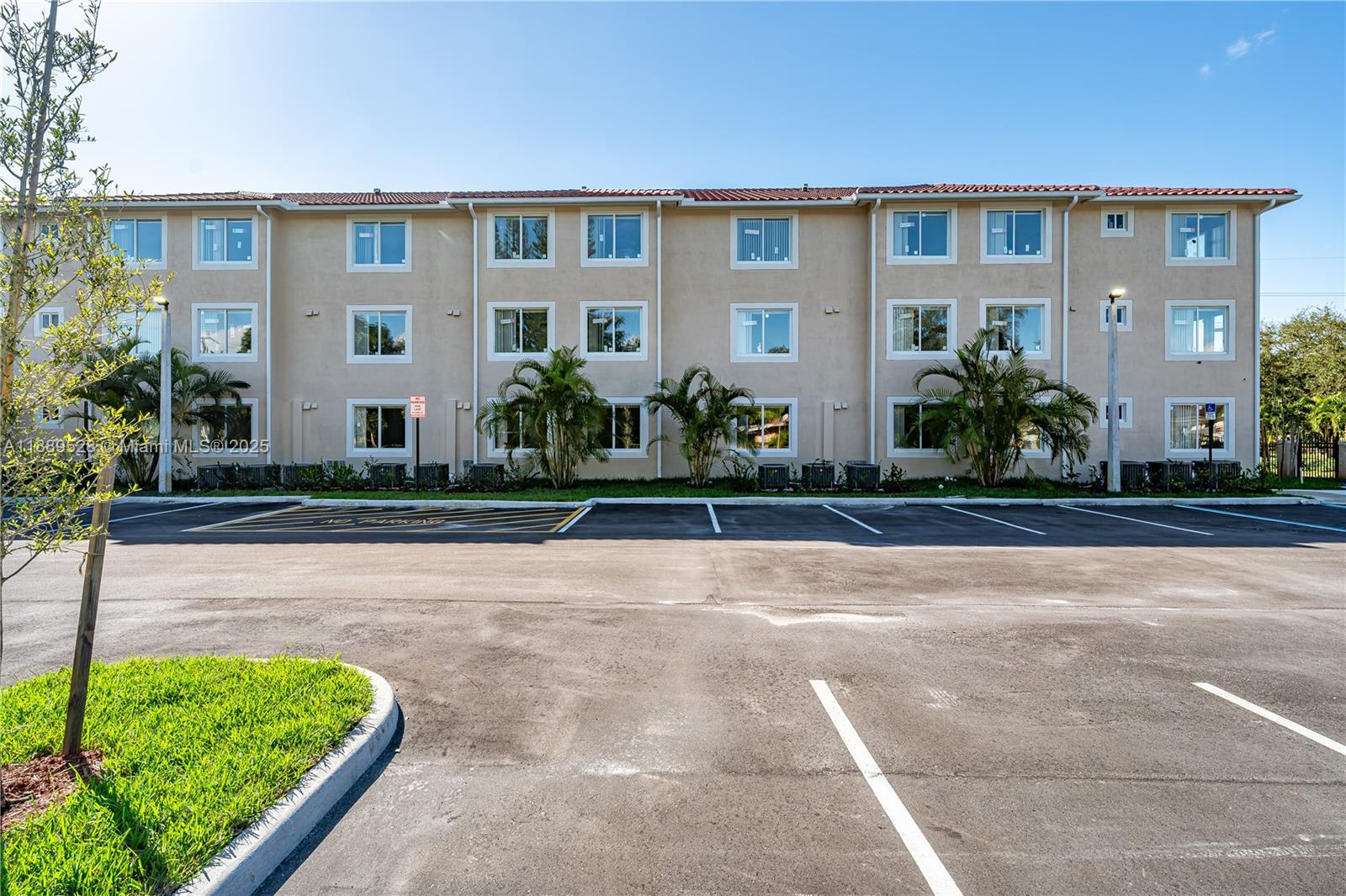 2575 Southwest 64th Avenue, Unit 7 Miramar, FL 33023 - Photo 1 of 13 a front view of a house with a yard