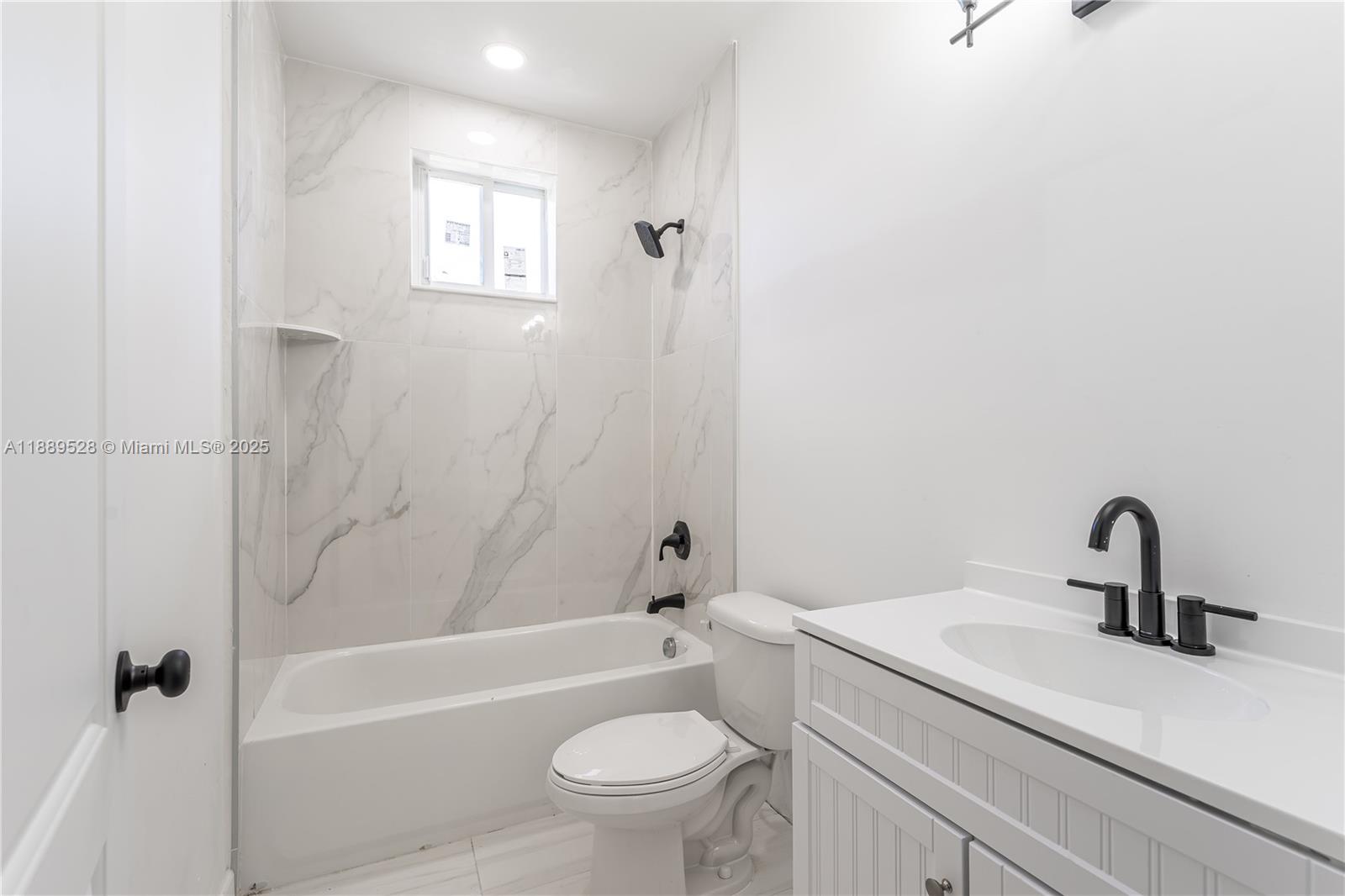 2575 Southwest 64th Avenue, Unit 7 Miramar, FL 33023 - Photo 12 of 13 a bathroom with a sink a toilet and shower