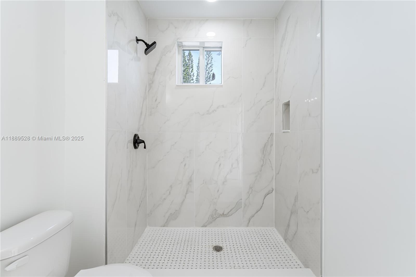 2575 Southwest 64th Avenue, Unit 7 Miramar, FL 33023 - Photo 9 of 13 a bathroom with a shower and toilet