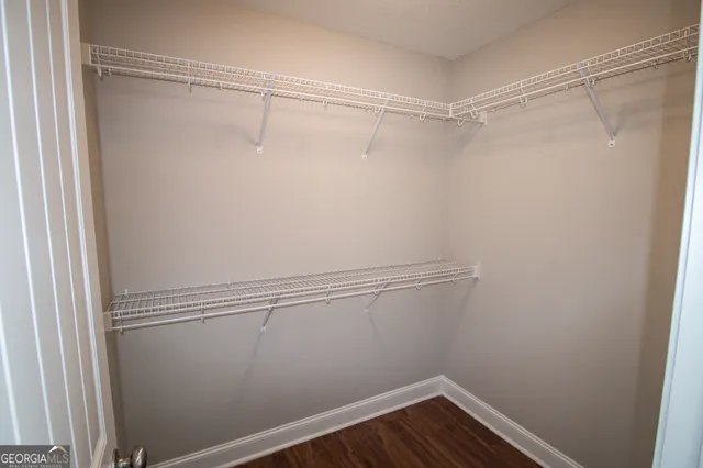 a view of an empty walk in closet