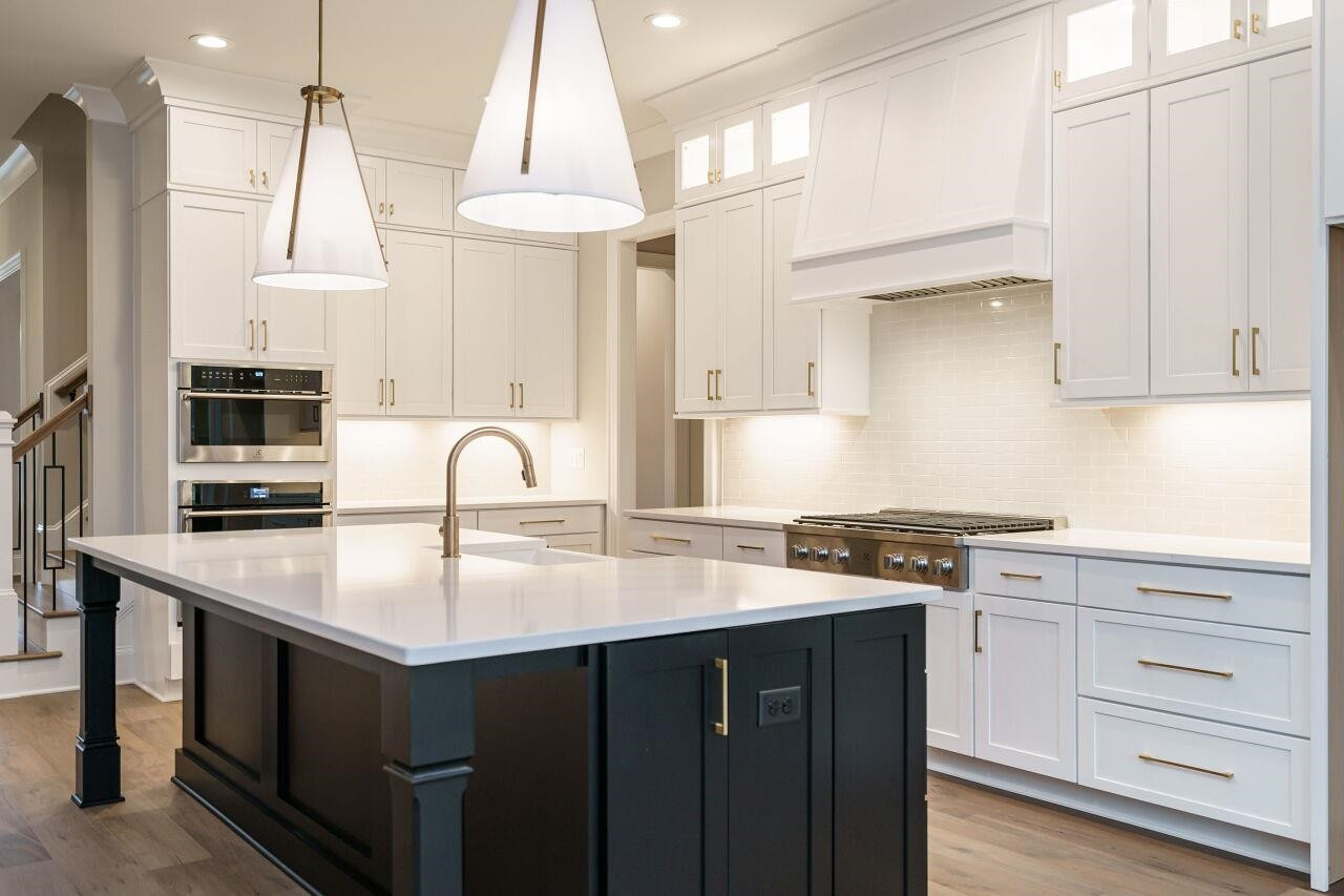 2125 Gardenbrook Drive Raleigh, NC 27606 - Photo 13 of 35 a kitchen with stainless steel appliances granite countertop a sink a stove and a refrigerator