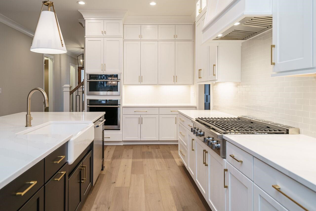 2125 Gardenbrook Drive Raleigh, NC 27606 - Photo 14 of 35 a kitchen with stainless steel appliances a sink dishwasher stove and refrigerator