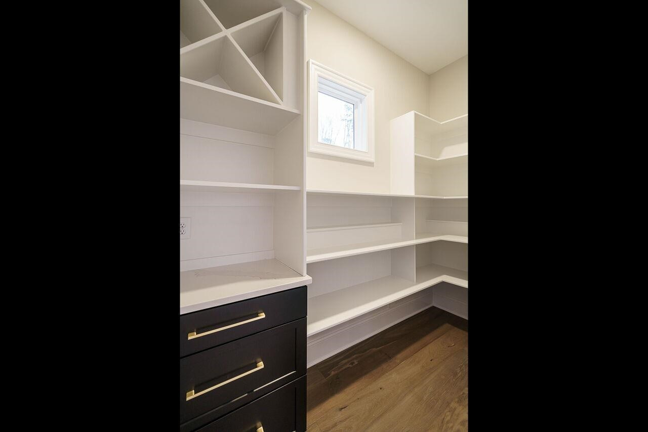 2125 Gardenbrook Drive Raleigh, NC 27606 - Photo 15 of 35 a view of walk in closet with empty racks