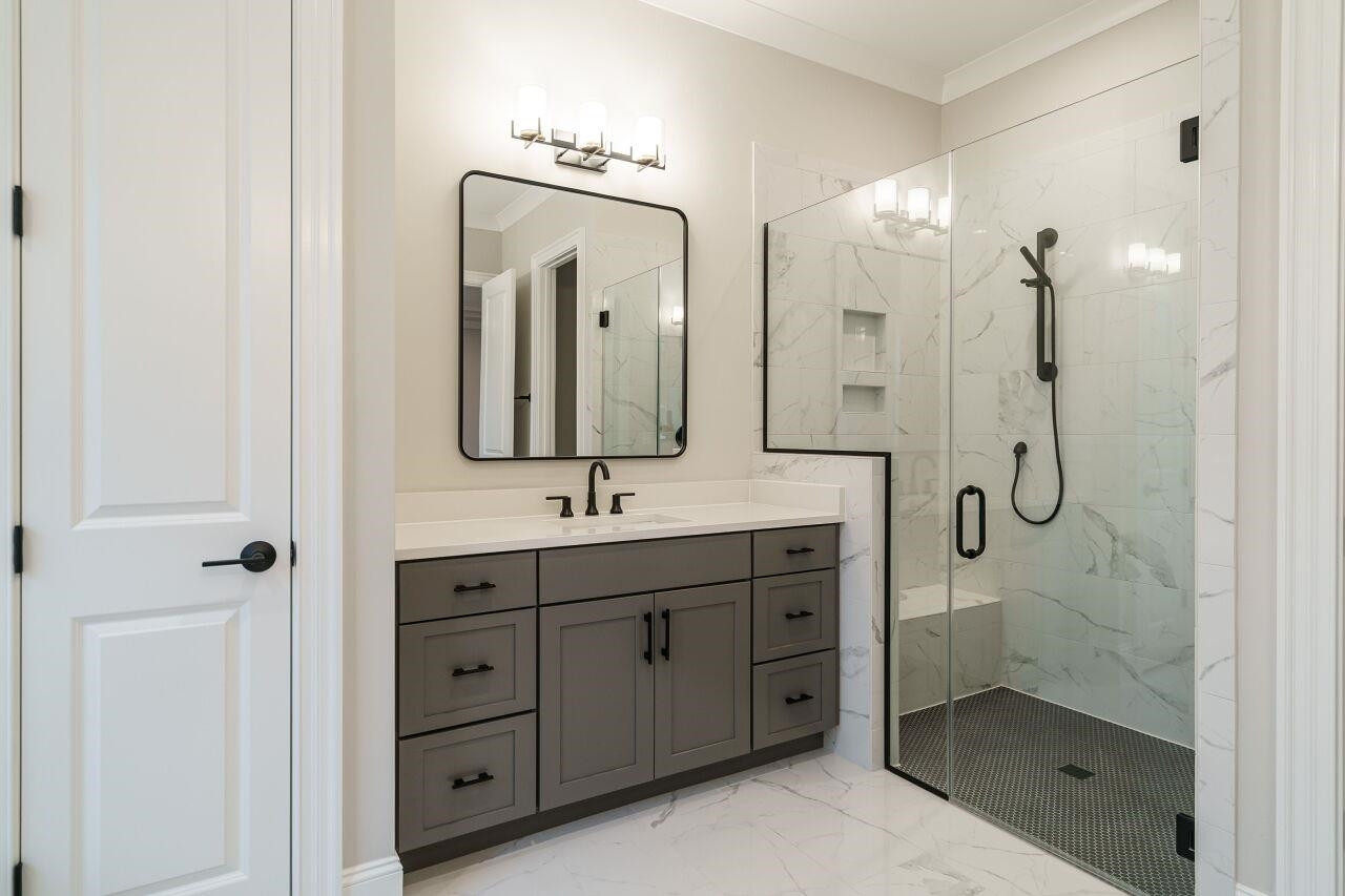 2125 Gardenbrook Drive Raleigh, NC 27606 - Photo 20 of 35 a bathroom with a double vanity sink mirror and double