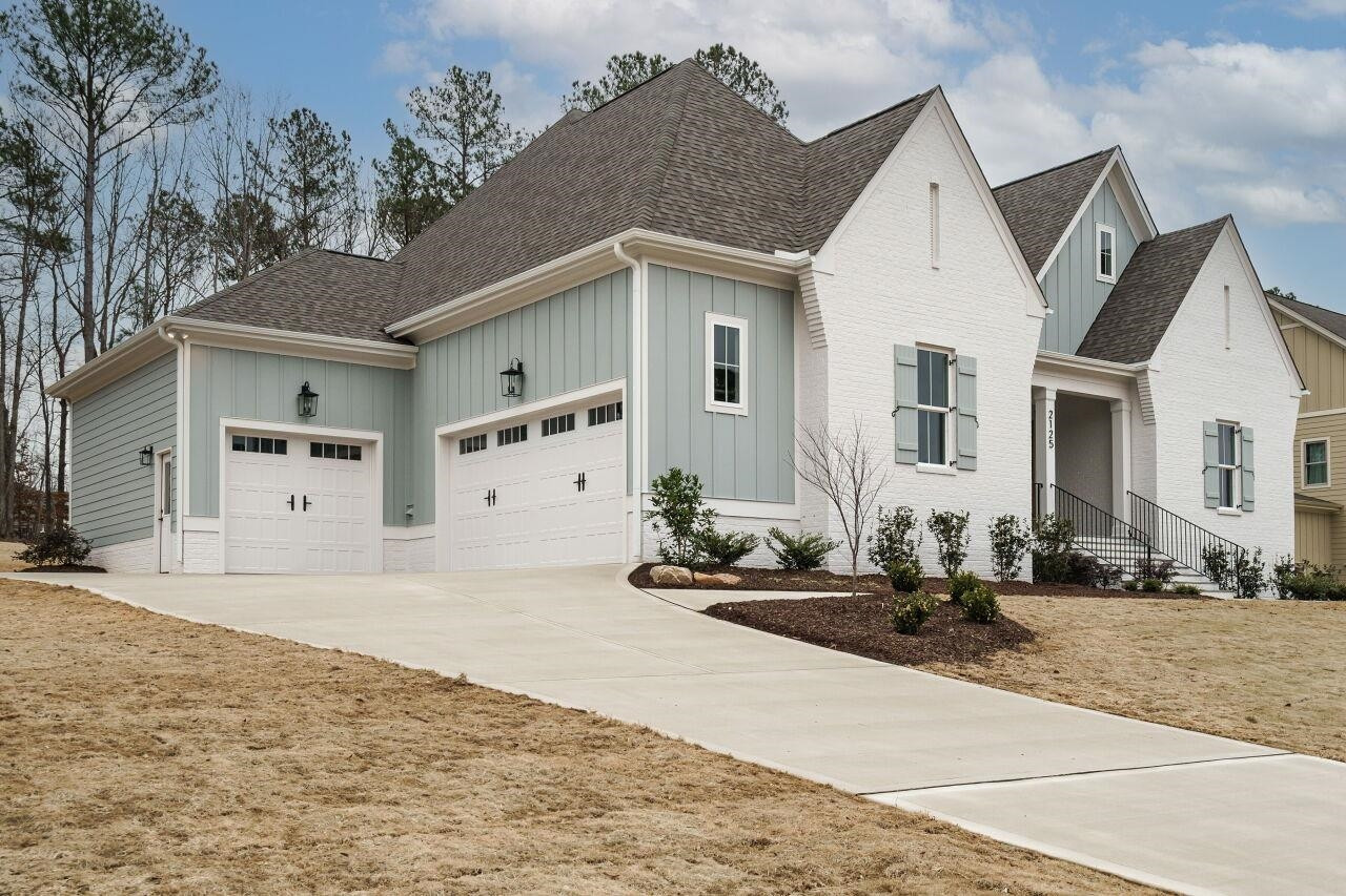 2125 Gardenbrook Drive Raleigh, NC 27606 - Photo 2 of 35 a view of a white house with a outdoor space