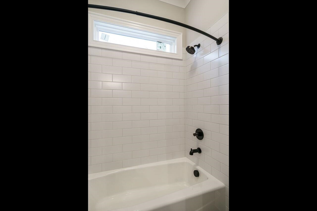2125 Gardenbrook Drive Raleigh, NC 27606 - Photo 24 of 35 a bathroom with a bathtub