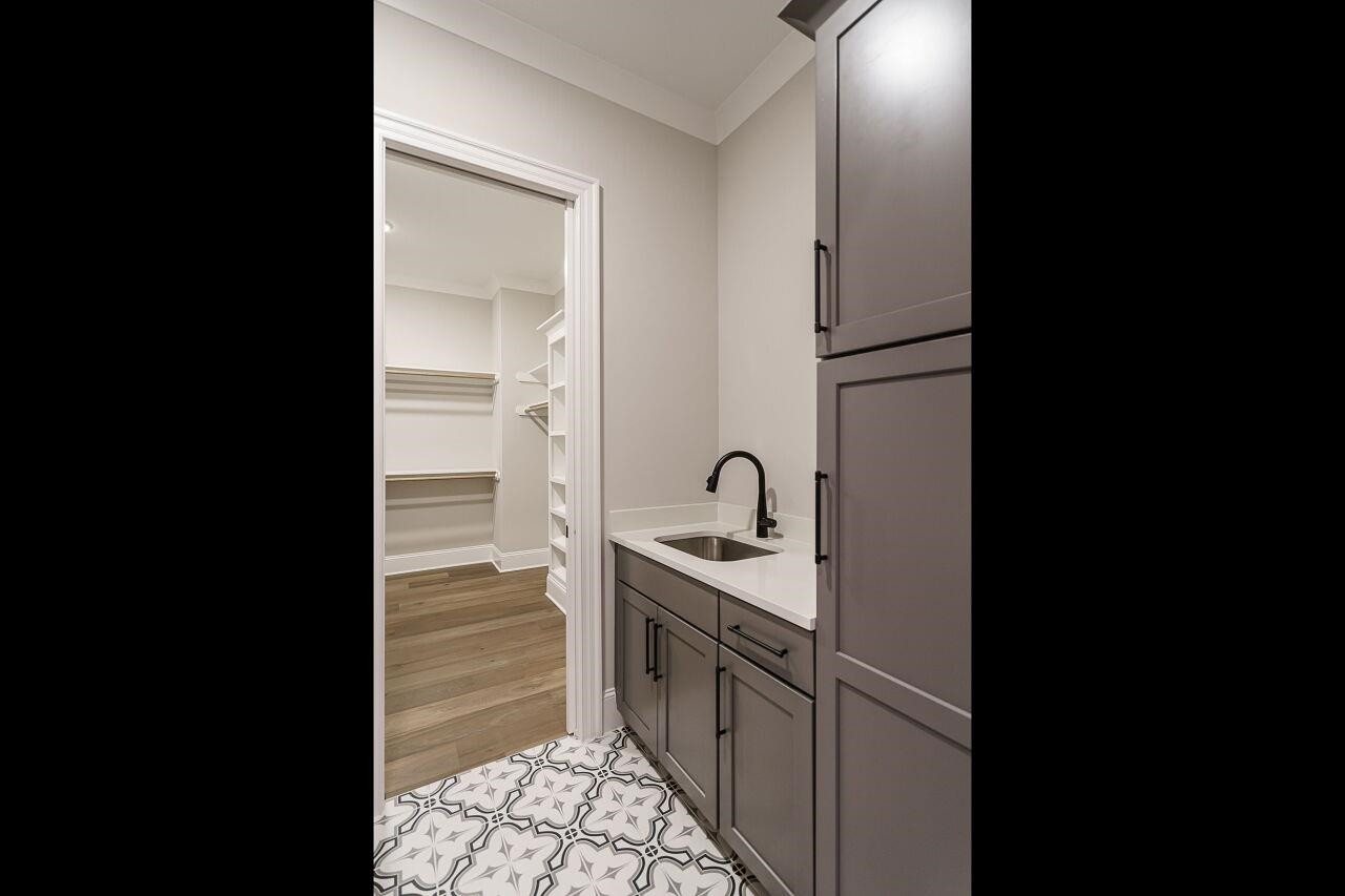 2125 Gardenbrook Drive Raleigh, NC 27606 - Photo 26 of 35 a kitchen with a sink and refrigerator