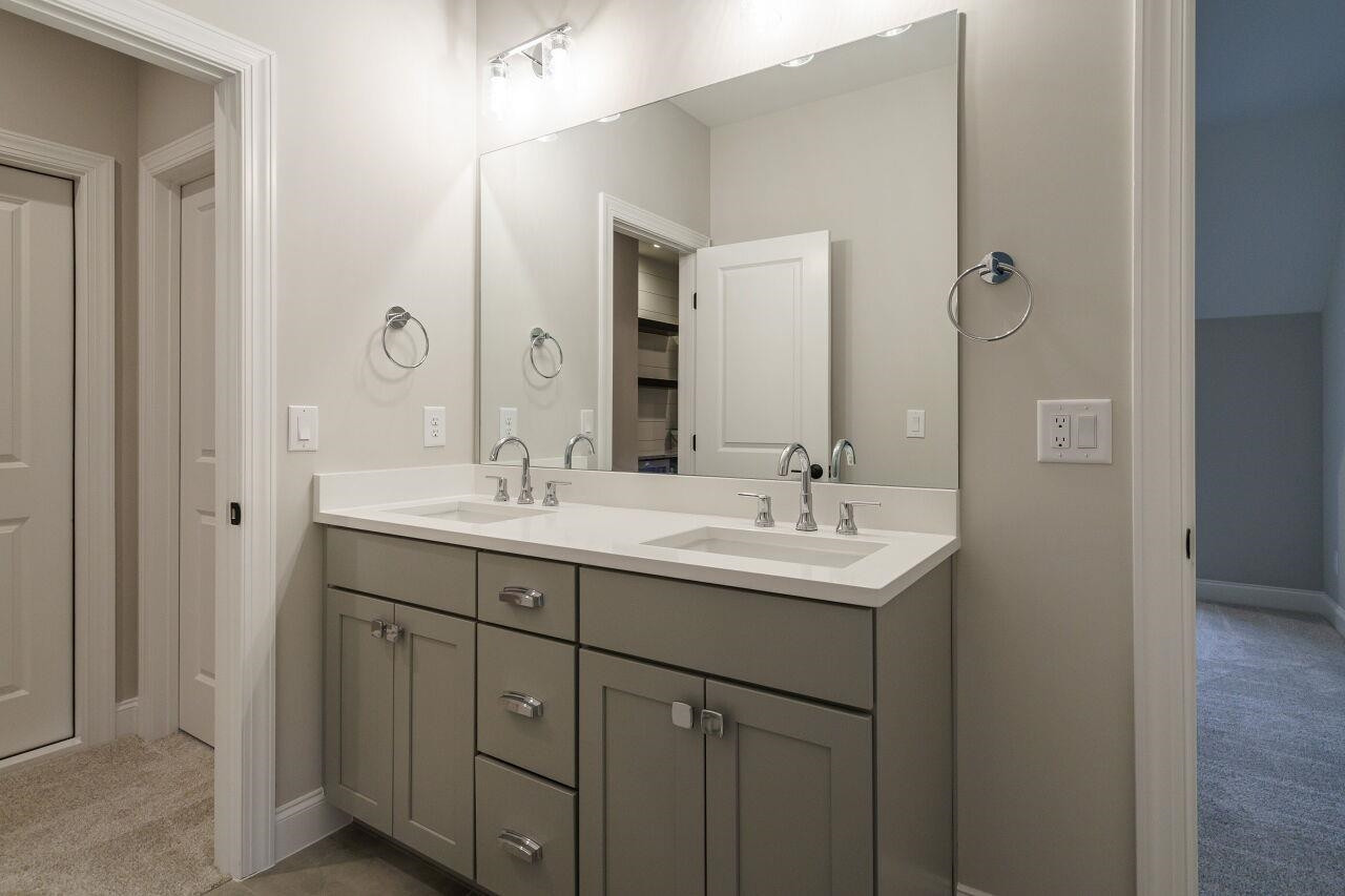 2125 Gardenbrook Drive Raleigh, NC 27606 - Photo 30 of 35 a bathroom with a sink and a mirror