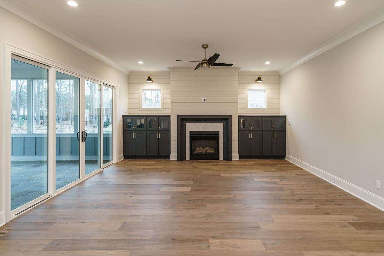 2125 Gardenbrook Drive Raleigh, NC 27606 - Photo 8 of 35 a view of an empty room with a fireplace and a window
